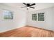 Bedroom featuring hardwood floors and two windows providing ample light at 2702 Galaxy Ct, Decatur, GA 30034