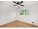 Bright bedroom featuring hardwood floors, a ceiling fan, and a window at 2702 Galaxy Ct, Decatur, GA 30034