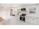 Contemporary kitchen featuring white cabinetry, quartz countertops, and stainless steel appliances at 2702 Galaxy Ct, Decatur, GA 30034