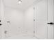 Clean laundry room with white marble floors and neutral paint at 2702 Galaxy Ct, Decatur, GA 30034