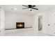 Cozy living room with fireplace, modern ceiling fan and neutral paint at 2702 Galaxy Ct, Decatur, GA 30034