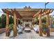 Outdoor fireplace lounge offers a cozy space with comfortable seating amidst lush greenery at 2795 Peachtree Ne Rd # 703, Atlanta, GA 30305