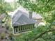 The backyard features a covered patio and lush landscaping at 3365 Sweetwater Dr, Cumming, GA 30041