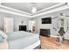 Comfortable bedroom featuring a TV, exercise equipment, and neutral walls, creating a calming space at 3365 Sweetwater Dr, Cumming, GA 30041