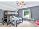 Bedroom with bunk bed, ceiling fan, and a large window with lots of natural light at 3365 Sweetwater Dr, Cumming, GA 30041