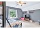 Bedroom with bunk bed, ceiling fan, TV, and beanbag chair at 3365 Sweetwater Dr, Cumming, GA 30041