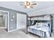 Bedroom featuring bunk bed, ceiling fan, and a view of the hallway at 3365 Sweetwater Dr, Cumming, GA 30041