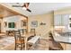 This dining area features a rustic dining table and an open concept kitchen at 3365 Sweetwater Dr, Cumming, GA 30041