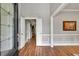 Elegant foyer featuring wood floors, detailed trim, and a clear view into the home's interior at 3365 Sweetwater Dr, Cumming, GA 30041