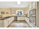 This kitchen features stainless steel appliances, granite countertops, and ample storage space at 3365 Sweetwater Dr, Cumming, GA 30041