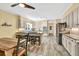 Updated kitchen with seating, stainless appliances, granite counters, and tile flooring at 3365 Sweetwater Dr, Cumming, GA 30041