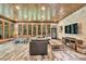This living room features a wood ceiling, exposed stone, and large picture windows at 3365 Sweetwater Dr, Cumming, GA 30041