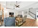 Spacious living room with staircase, neutral paint, and well-appointed furniture at 3365 Sweetwater Dr, Cumming, GA 30041