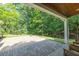 Outdoor patio area with stone pavers and view of wooded backyard at 3365 Sweetwater Dr, Cumming, GA 30041
