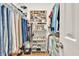Organized walk-in closet with shelving for shoes and clothing, offering storage and easy access at 3365 Sweetwater Dr, Cumming, GA 30041