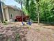 Beautiful backyard features a firepit area with seating and a large deck great for entertaining at 3460 Ebenezer Rd, Marietta, GA 30066
