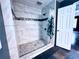 Modern bathroom featuring a glass enclosed tile shower with decorative accent tile at 3460 Ebenezer Rd, Marietta, GA 30066