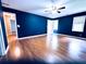 Bedroom showcasing gleaming hardwood floors, a ceiling fan, and neutral walls at 3460 Ebenezer Rd, Marietta, GA 30066