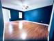 Spacious bedroom with ceiling fan and hardwood floors at 3460 Ebenezer Rd, Marietta, GA 30066