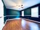 Bedroom featuring green walls, wood-look flooring, and a ceiling fan at 3460 Ebenezer Rd, Marietta, GA 30066