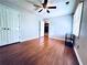 Bedroom featuring gray walls, vinyl floors, a ceiling fan, closet, and natural light at 3460 Ebenezer Rd, Marietta, GA 30066