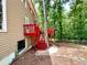 Side view of the spacious raised deck with painted railings and steps leading to the backyard at 3460 Ebenezer Rd, Marietta, GA 30066