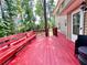 Large deck with railings and built-in bench seating surrounded by a lush landscape at 3460 Ebenezer Rd, Marietta, GA 30066