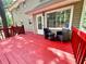Open deck with outdoor seating overlooks a landscaped backyard and wooded views at 3460 Ebenezer Rd, Marietta, GA 30066