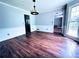Hardwood floors, chandelier and wainscoting make this dining room feel elegant at 3460 Ebenezer Rd, Marietta, GA 30066