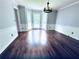 Bright dining room featuring a bay window, updated lighting, and hardwood floors at 3460 Ebenezer Rd, Marietta, GA 30066