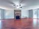 Spacious living room features a stone fireplace, wood floors, and ample natural light at 3460 Ebenezer Rd, Marietta, GA 30066