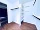 Large walk-in closet providing ample storage with built in shelving and hanging racks at 3460 Ebenezer Rd, Marietta, GA 30066