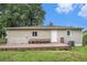 Rear exterior with spacious deck, grassy area, and siding on a bright sunny day at 2621 Walton Sw Way, Marietta, GA 30060