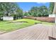 Spacious backyard with a large wooden deck, grass lawn, shed, and wood fence at 2621 Walton Sw Way, Marietta, GA 30060