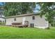 Back of home featuring a wooden deck, grassy yard, and neutral siding at 2621 Walton Sw Way, Marietta, GA 30060