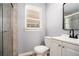 This bathroom features a toilet, vanity with sink, and tiled walk-in shower at 2621 Walton Sw Way, Marietta, GA 30060