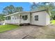 This home's exterior is painted white and gray, with a small porch in front at 2621 Walton Sw Way, Marietta, GA 30060