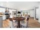 A kitchen and living room area are combined with a dining room table at 2621 Walton Sw Way, Marietta, GA 30060