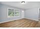 This open living room area offers hard wood floors and bright light through large windows at 2621 Walton Sw Way, Marietta, GA 30060