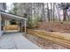 A covered patio overlooks a tiered, landscaped backyard at 264 Ascott Ln, Woodstock, GA 30189