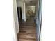 Beautiful entry hallway features hardwood floors and a decorative glass front door at 264 Ascott Ln, Woodstock, GA 30189