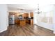 Modern kitchen boasts stainless steel appliances, a center island, and hardwood floors at 264 Ascott Ln, Woodstock, GA 30189