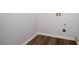 Utility room ready for a washer and dryer with hardwood-style flooring at 264 Ascott Ln, Woodstock, GA 30189