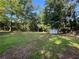 This backyard boasts a storage shed and ample space for outdoor activities at 4720 Fowler Cir, Acworth, GA 30101