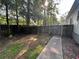 Backyard with a fence and concrete walkway at 4720 Fowler Cir, Acworth, GA 30101