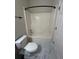 Clean bathroom featuring a toilet and bathtub with white finishes at 4720 Fowler Cir, Acworth, GA 30101