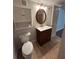 Bathroom with storage cabinet, neutral paint, mirror and tiled floor at 4720 Fowler Cir, Acworth, GA 30101