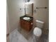 Cozy bathroom with granite countertops, a small vanity, and toilet at 4720 Fowler Cir, Acworth, GA 30101