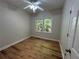 Cozy bedroom featuring a window and wood-look floors, offering a bright and inviting space at 4720 Fowler Cir, Acworth, GA 30101
