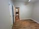 Bedroom with wood-look flooring, closet and doorway, offering a blend of comfort and functionality at 4720 Fowler Cir, Acworth, GA 30101